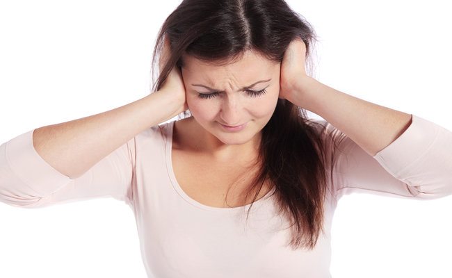 ear infection pain hands over ears